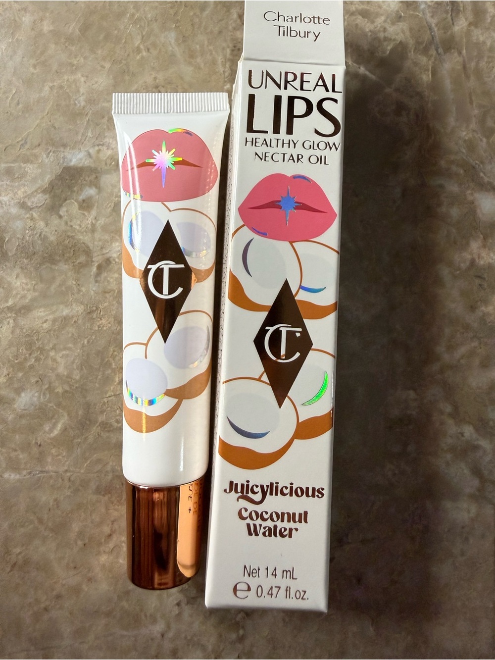 💋3-$36💋Charolette Tilbury Unreal Lips Juicylicious Coconut Water Lip Oil - Pink